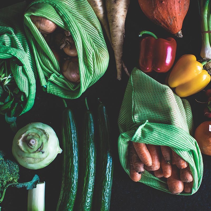 reusable produce bags vegetables on a table