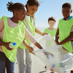 young people participating in beach cleanup project