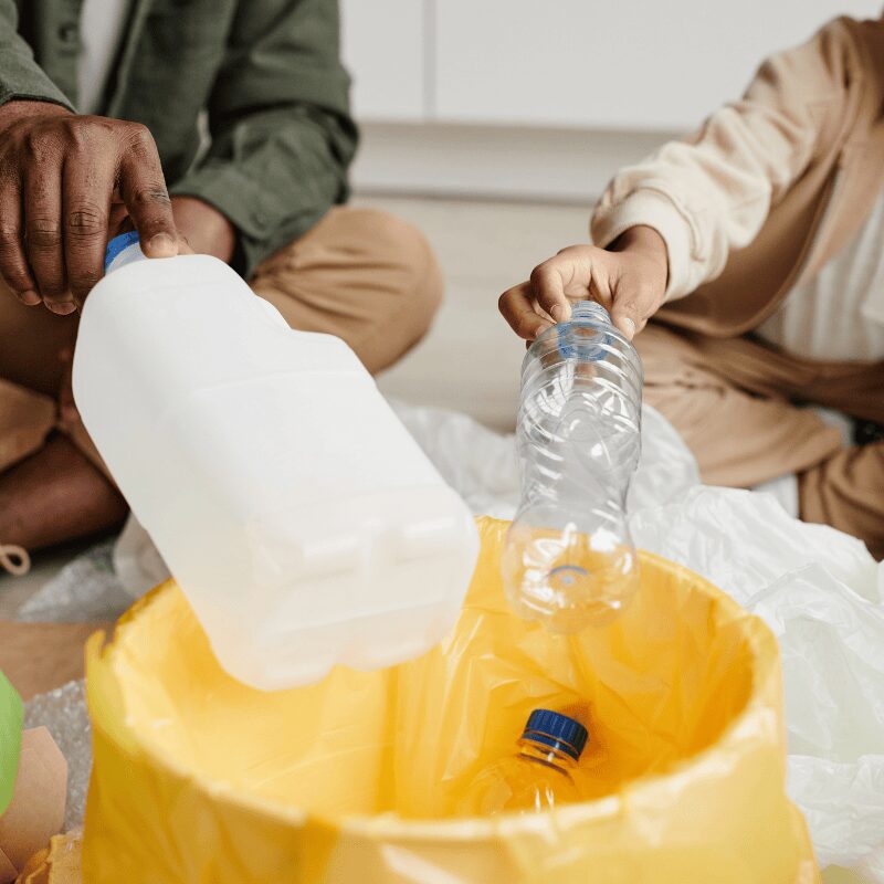 father and son recycling plastics