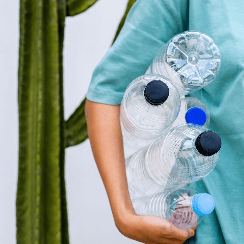 hands holding plastic bottles